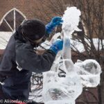 Sculptor at work on his sculpture, adding ice flowers to a bouquet, during the Asahikawa Winter Festival.
