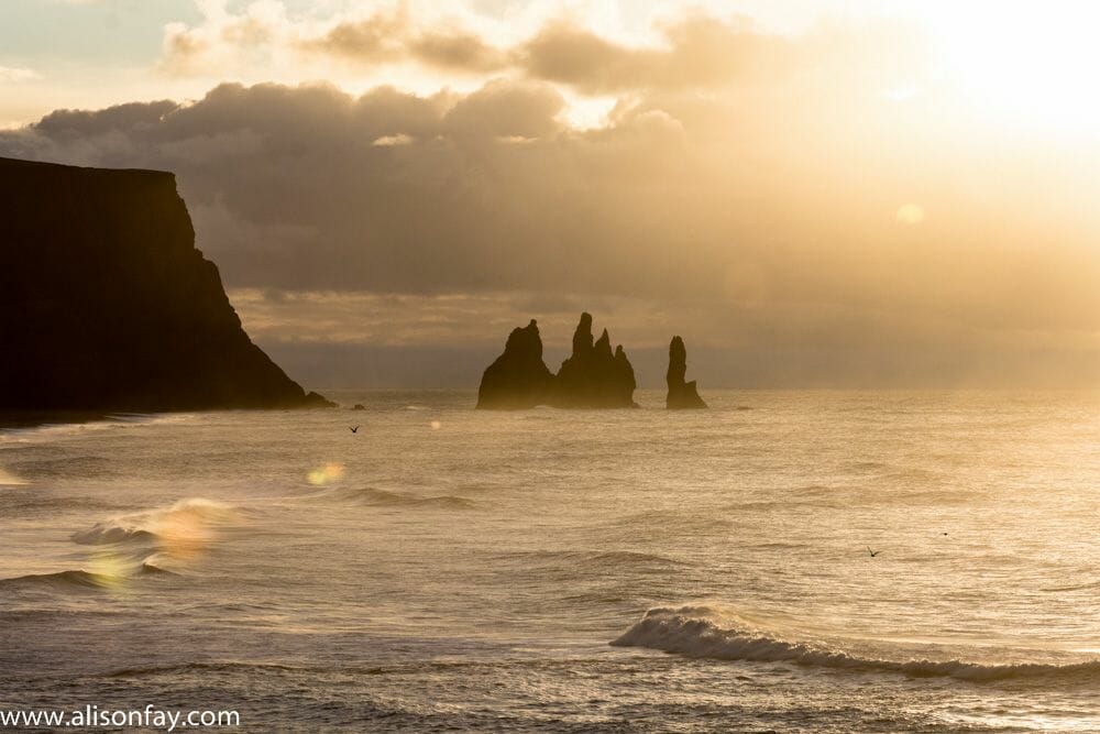 View of Reynisdrangar rock formations in Iceland during sunrise