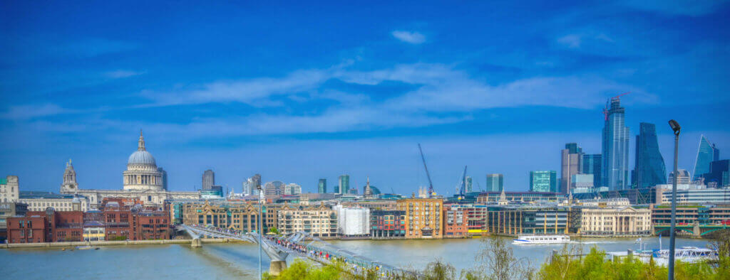 St. Paul's Cathedral across Millennium Bridge and the River Thames in London, UK.