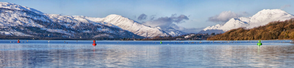 A panoramic view of the majestic and impressive ben lomond from across loch lomond near the scottish town of balloch.